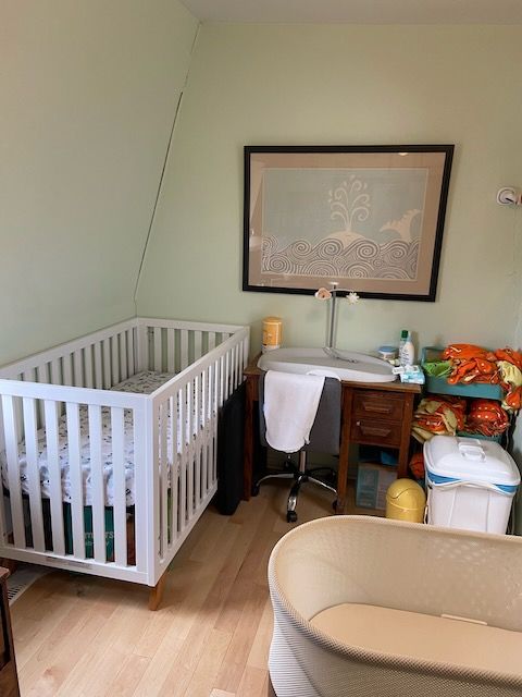 Photo of a nursery with crib and Snoo