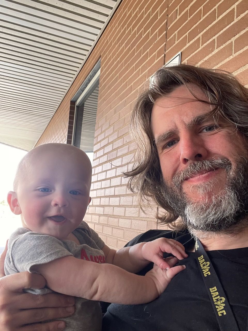 A baby and his father, selfie style